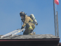 Firefighter on Roof photo