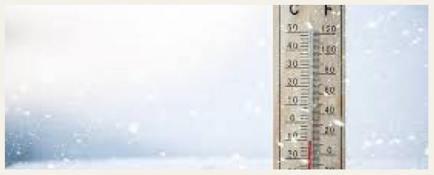thermometer showing low temps in snow